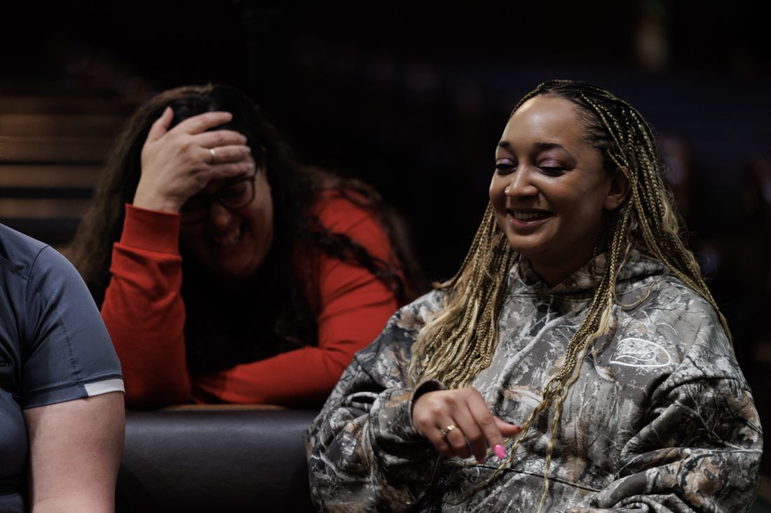 Two participants laughing together during a session