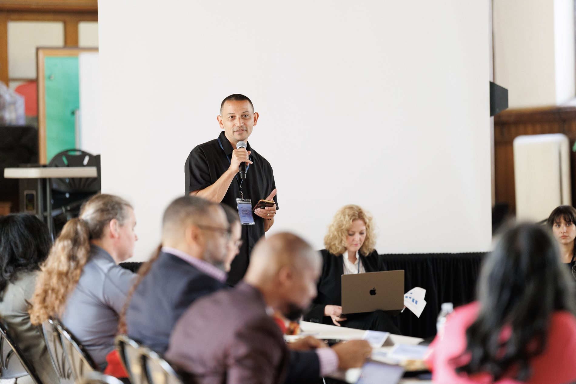 A speaker addressing clergy and congregational leaders at a training session